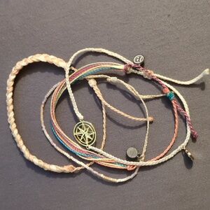 Set of 4 Pura Vida bracelets along with 4 other adjustable woven bracelets